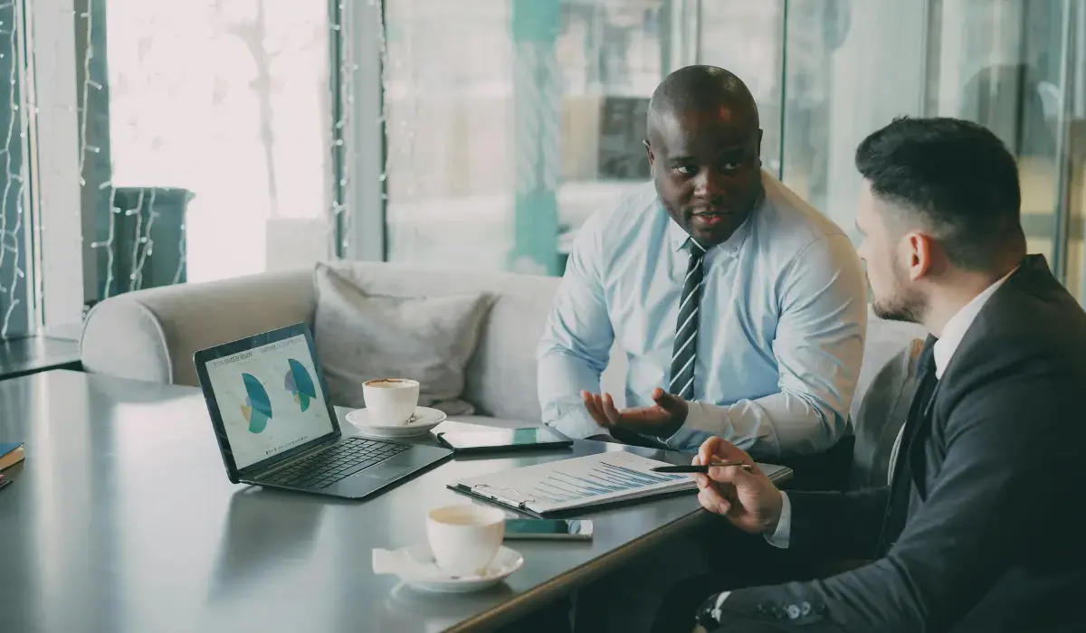 Risk leader advising his CFO on strategy using risk intelligence data.